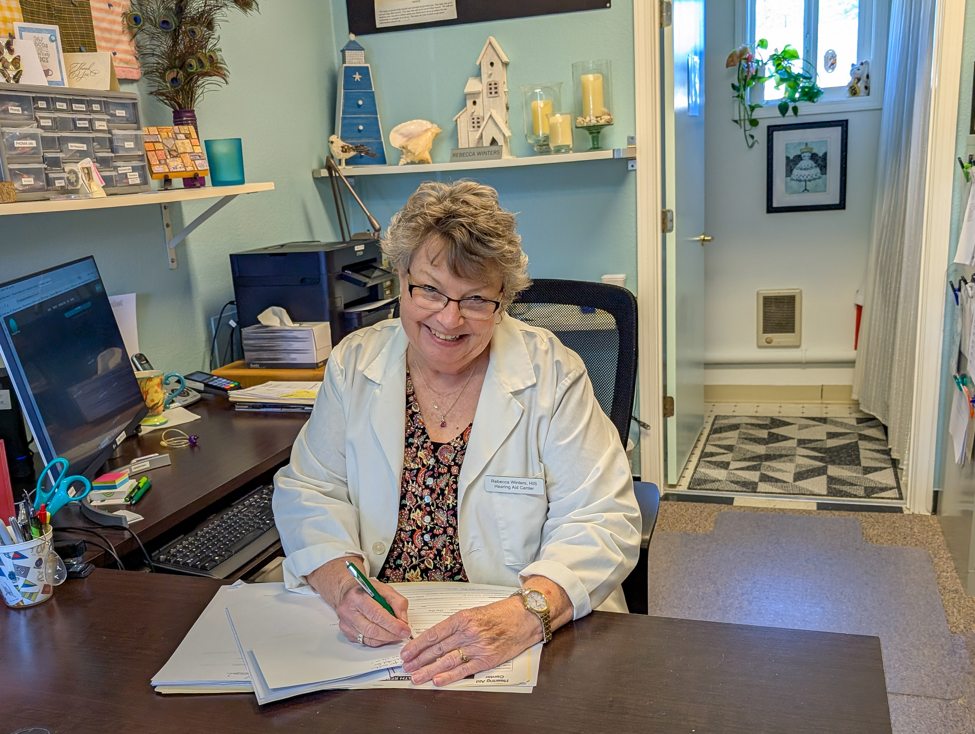 Rebecca Winters HIS at her desk at Hearing Aid Center Ocean Park Washington